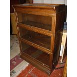 A three glazed section Globe Wernicke style oak bookcase.