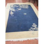 A Chinese export carpet with blue ground decorated with butterflies 185 x 274cm