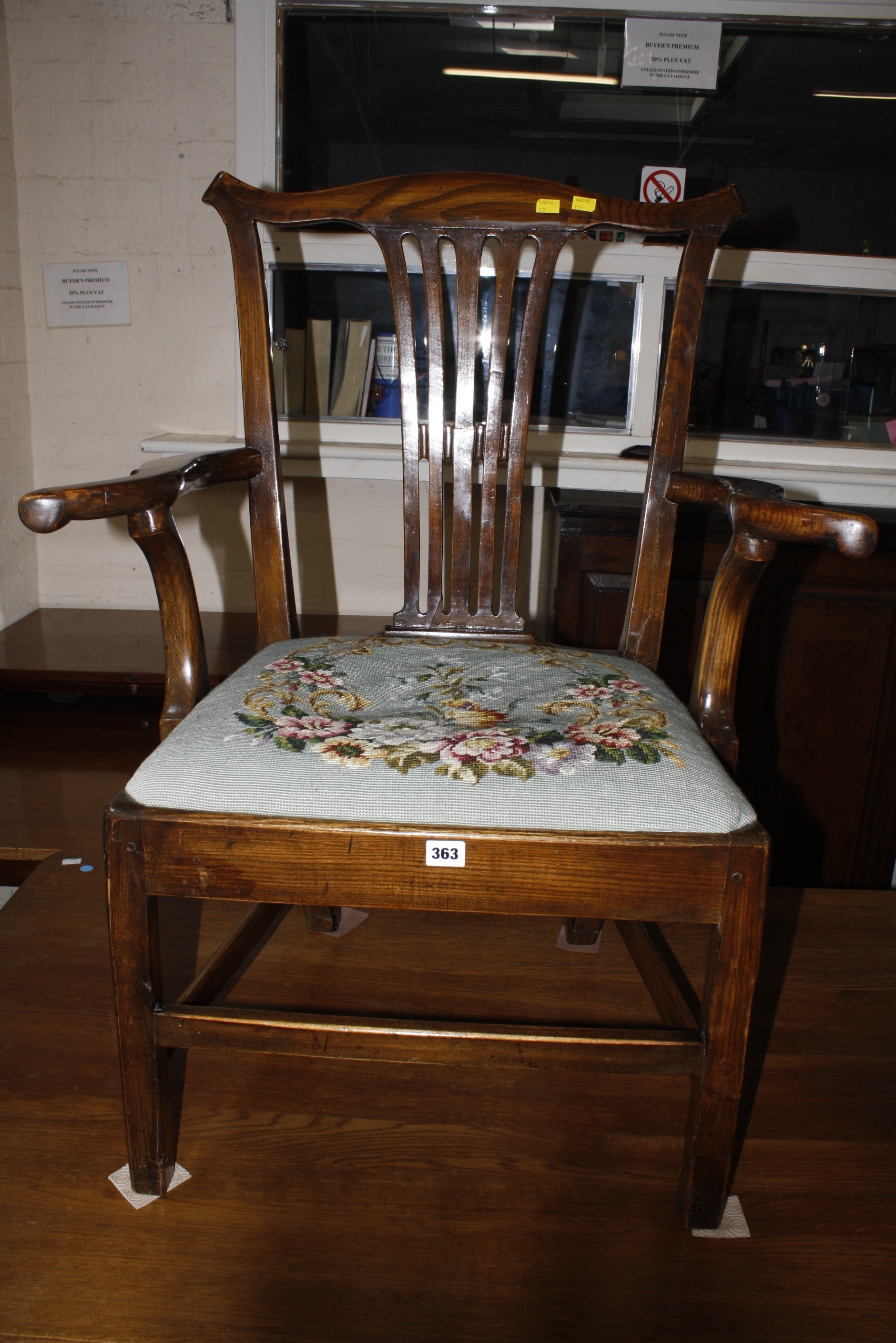 A George III style open armchair, with a needlework seat on square legs   Best Bid