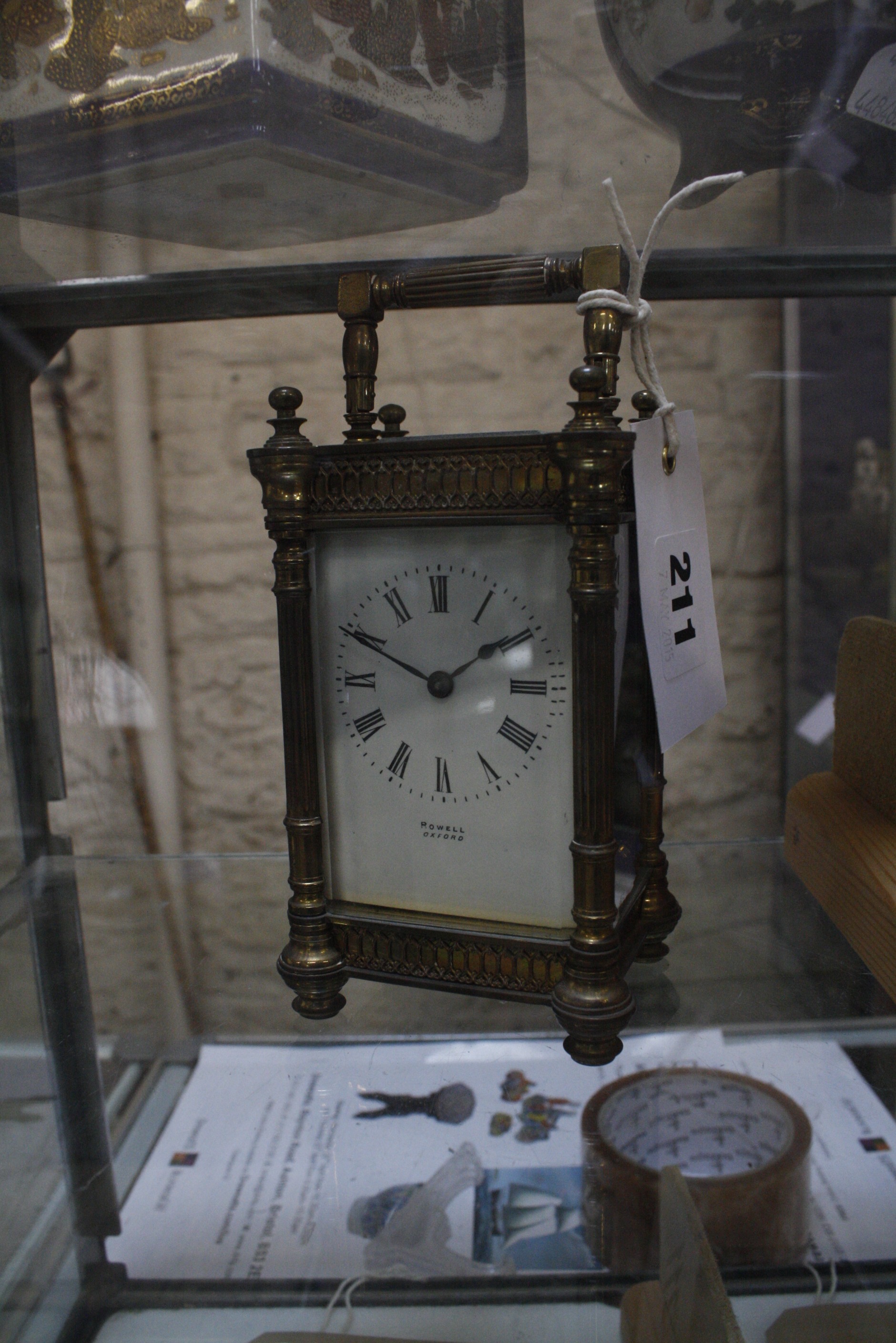 A 19th Century brass cased carriage clock, the enamel dial with Roman numerals inscribed Rowell