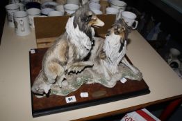 A Giuseppe Armani 'Companions' model group of collie dogs, on rectangular plinth base, 42cm wide