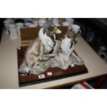 A Giuseppe Armani 'Companions' model group of collie dogs, on rectangular plinth base, 42cm wide