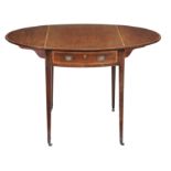 A George III mahogany pembroke table, circa 1800, with an oval crossbanded top and two frieze