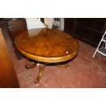 A Victorian burr walnut cross banded oval center table on a pedestal base.