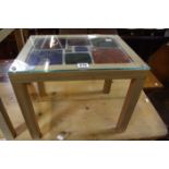 A small Japanese oak  table with 16ml hardened glass top with leaded light insert