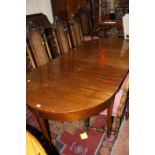 A 19th Century D end dining table with a fold out center section.