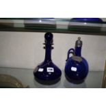 A English blue decanter, with plated Rum label and a English blue claret jug having plated neck