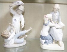Four NAO figure groups to include two ballerina figures, a group of two boys having a pillow fight