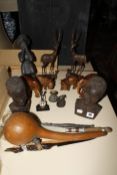 A quantity of African collectable items to include carved wooden elephants, hippos, figures, etc