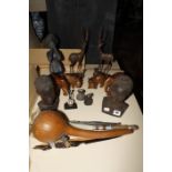 A quantity of African collectable items to include carved wooden elephants, hippos, figures, etc