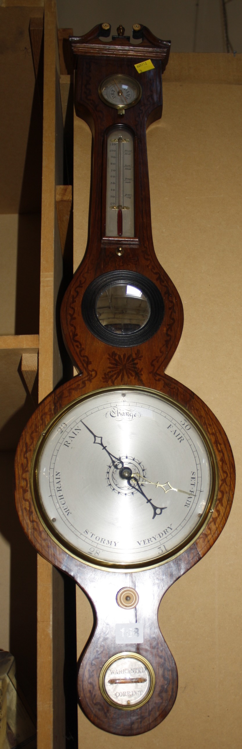 A 19th Century wheel barometer, the swan neck pediment above silvered dial and thermometer, 95.5cm