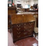 A 19th Century  mahogany bureau with four long drawers on bracket feet