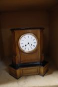 An early 20th Century ebonised and walnut cased mantel clock, 39cm high