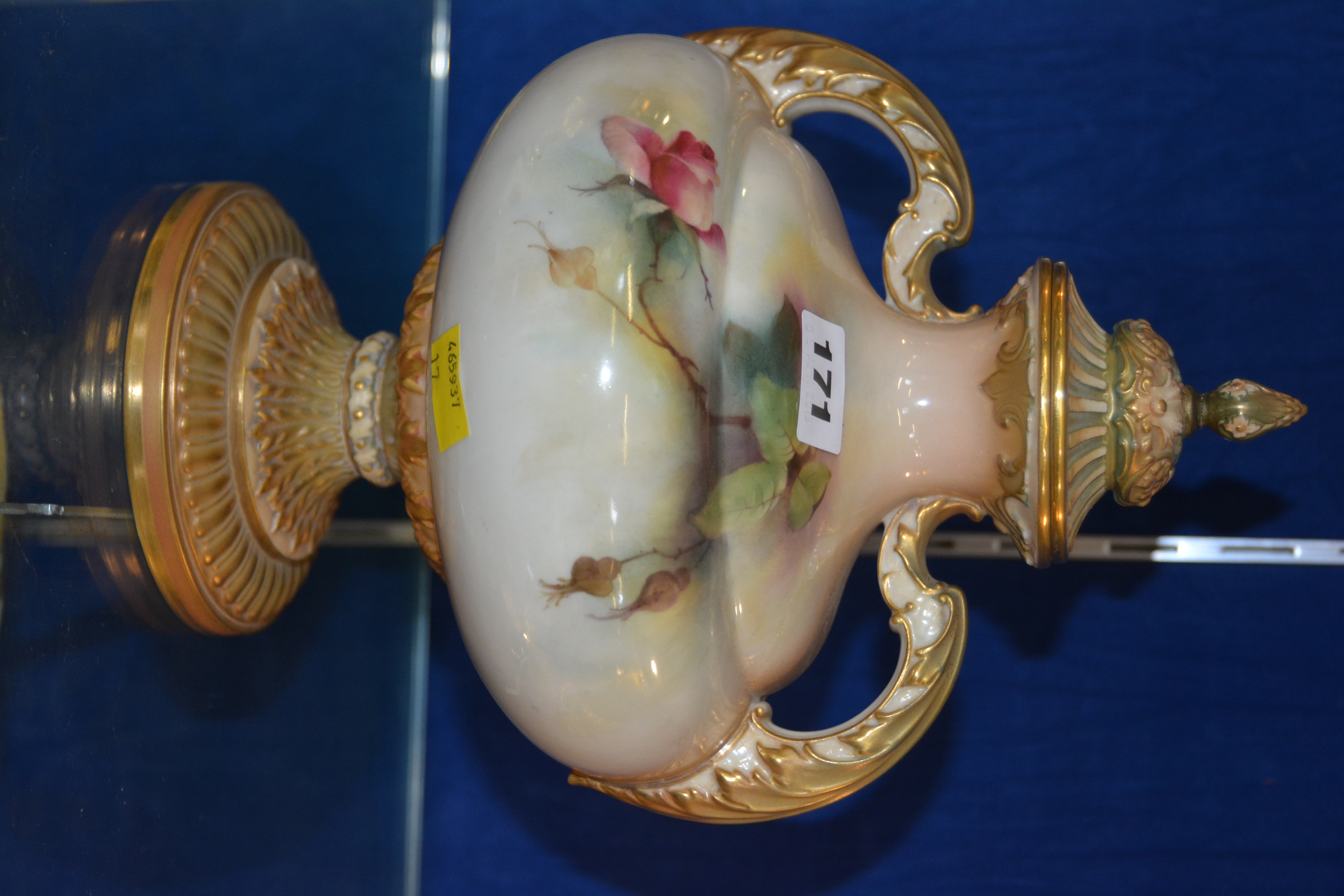 A Royal Worcester pedestal two-handled vase and cover, painted with roses, by R. Austin, date code