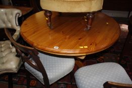 A pine circular dining table 112cm diameter
