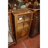 An Edwardian marquetry and glazed mahogany music cabinet, circa 1900, 102cm high, 48cm wide