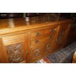 An Edwardian walnut Aesthetic design sideboard with drawers over a cabinet. 183cm wide.
