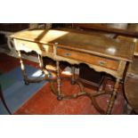 A walnut and crossbanded dresser base in the 18th Century style fitted two drawers on slender turned