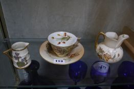 A Royal Worcester blush ivory tea cup and saucer, floral decorated, and two other Royal Worcester