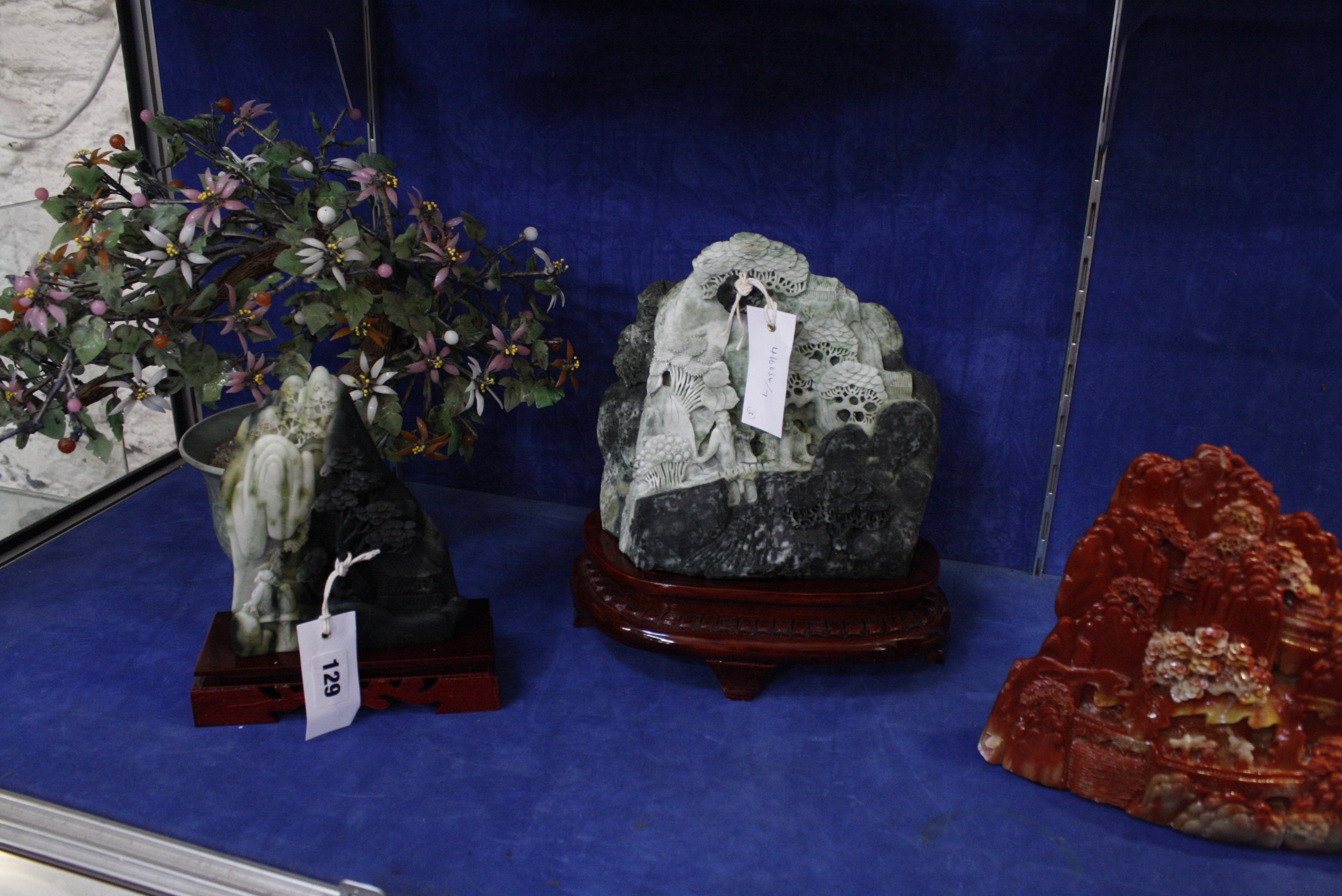 Three Oriental carved soapstone ornaments and a small ornamental tree (4)