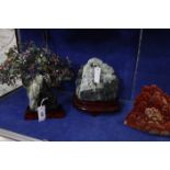 Three Oriental carved soapstone ornaments and a small ornamental tree (4)