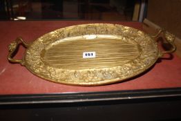 A late 19th century gilt copper electrotype twin handled oval dish, probably German, 42cm wide