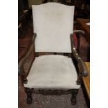 An Italian carved stained beech high back armchair