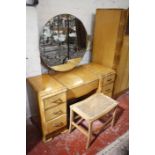 An Art Deco bedroom suite, comprising a wardrobe 187cm high, 118cm wide, a dressing table with