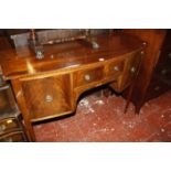A reproduction mahogany bowfront sideboard 123cm wide
