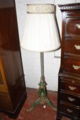 A Victorian gilt metal and painted standard lamp and shade.(sold as parts)
