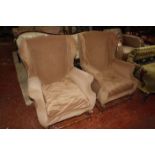 A pair of wing armchairs