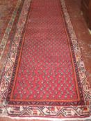 A Persian woven runner, 20th century, 510 x 102cm, together with a further Persian runner