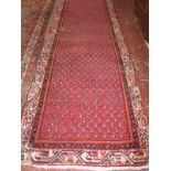 A Persian woven runner, 20th century, 510 x 102cm, together with a further Persian runner