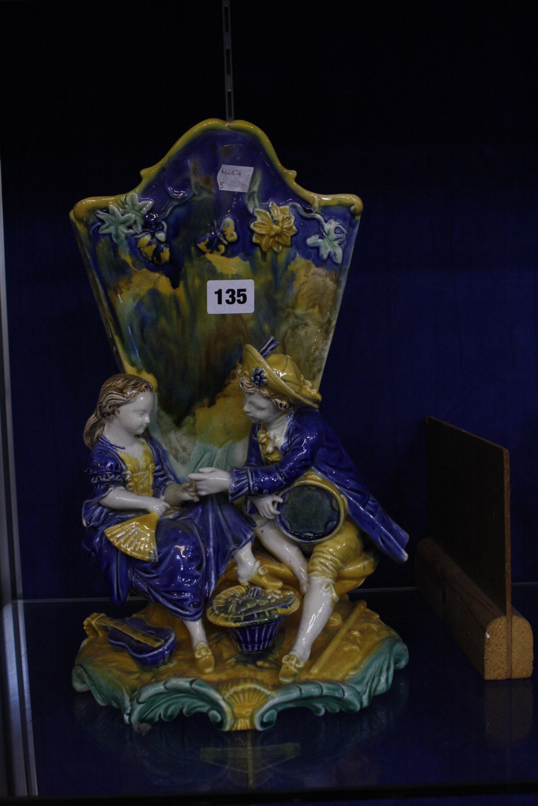 A modern Majolica vase, fan shaped with a figural base, 36cm high