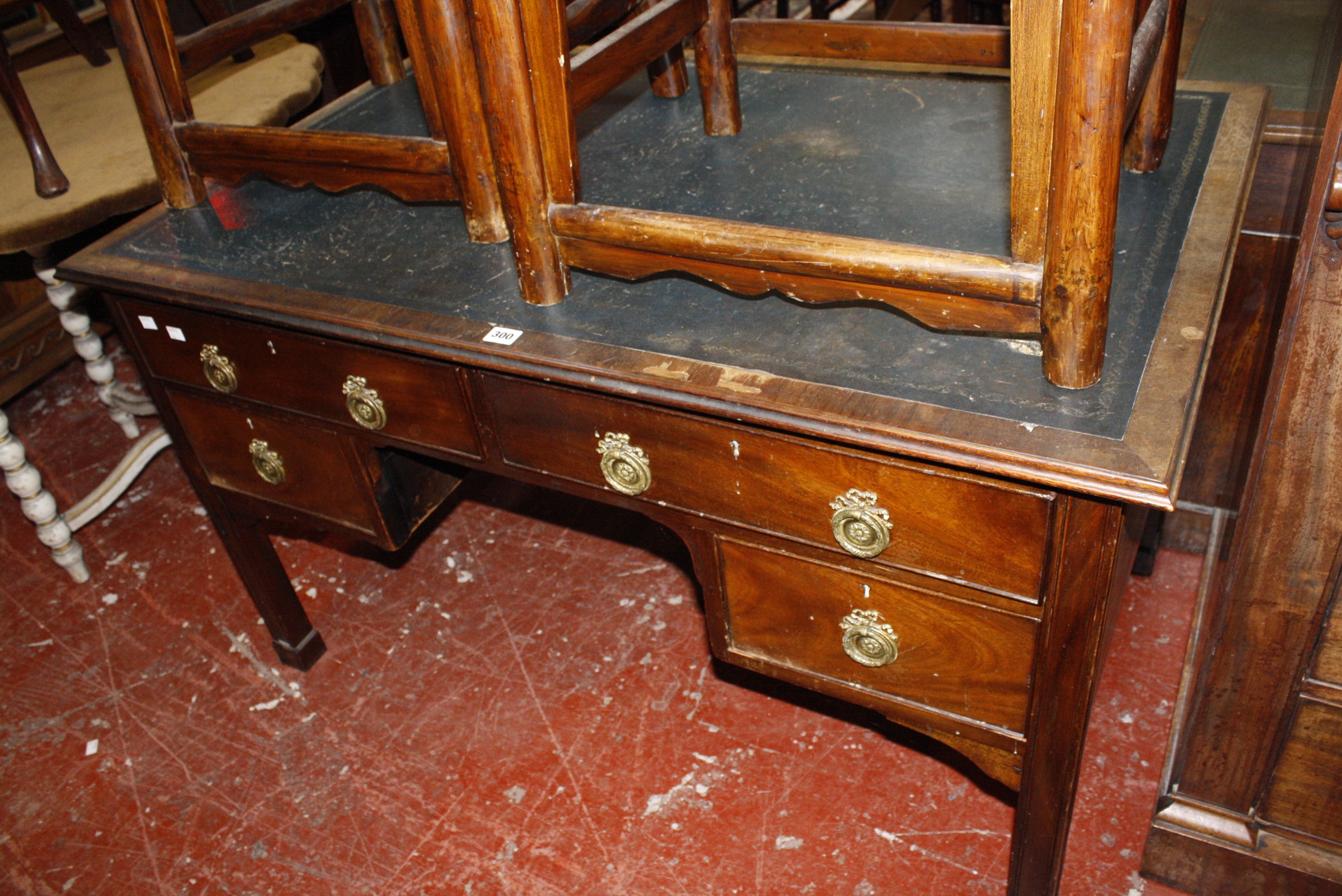 An early 19th century kneehole writing desk.