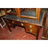 An early 19th century kneehole writing desk.
