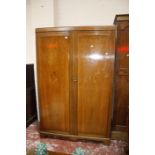 A walnut two door wardrobe.122cm wide x 191cm high.