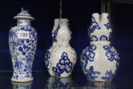 A pair of Chinese blue and white gourd vases, 22cm high (one AF) and a blue and white small baluster