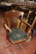 A 20th Century mahogany swivel desk chair