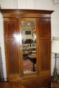 Edwardian mahogany and satinwood  inlaid wardrobe,with a single mirrored door.120cm wide x 205cm