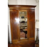 Edwardian mahogany and satinwood  inlaid wardrobe,with a single mirrored door.120cm wide x 205cm