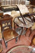 A late Victorian mahogany hall chair, carved standard lamp, two tier occasional table and an