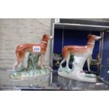 A pair of Staffordshire pottery grey hounds, 18cm high   Best Bid