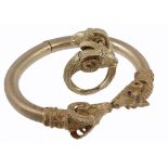 A ram's head bangle, the hinged bangle with ram's head terminals  A ram's head bangle,   the