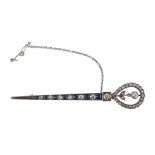 A sapphire and diamond brooch, the horse shoe nail style bar set with...  A sapphire and diamond
