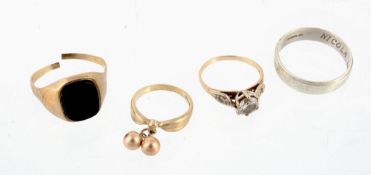 A 9 carat gold band ring ; a beaded ring; a zircon dress ring; and a black...  A 9 carat gold band
