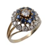 A sapphire and diamond cluster ring, the central brilliant cut diamond claw...  A sapphire and