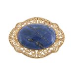 A lapis lazuli brooch, the central oval cabochon lapis lazuli within a...  A lapis lazuli