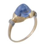 A sapphire and diamond ring, the central sugar loaf cabochon sapphires...  A sapphire and diamond