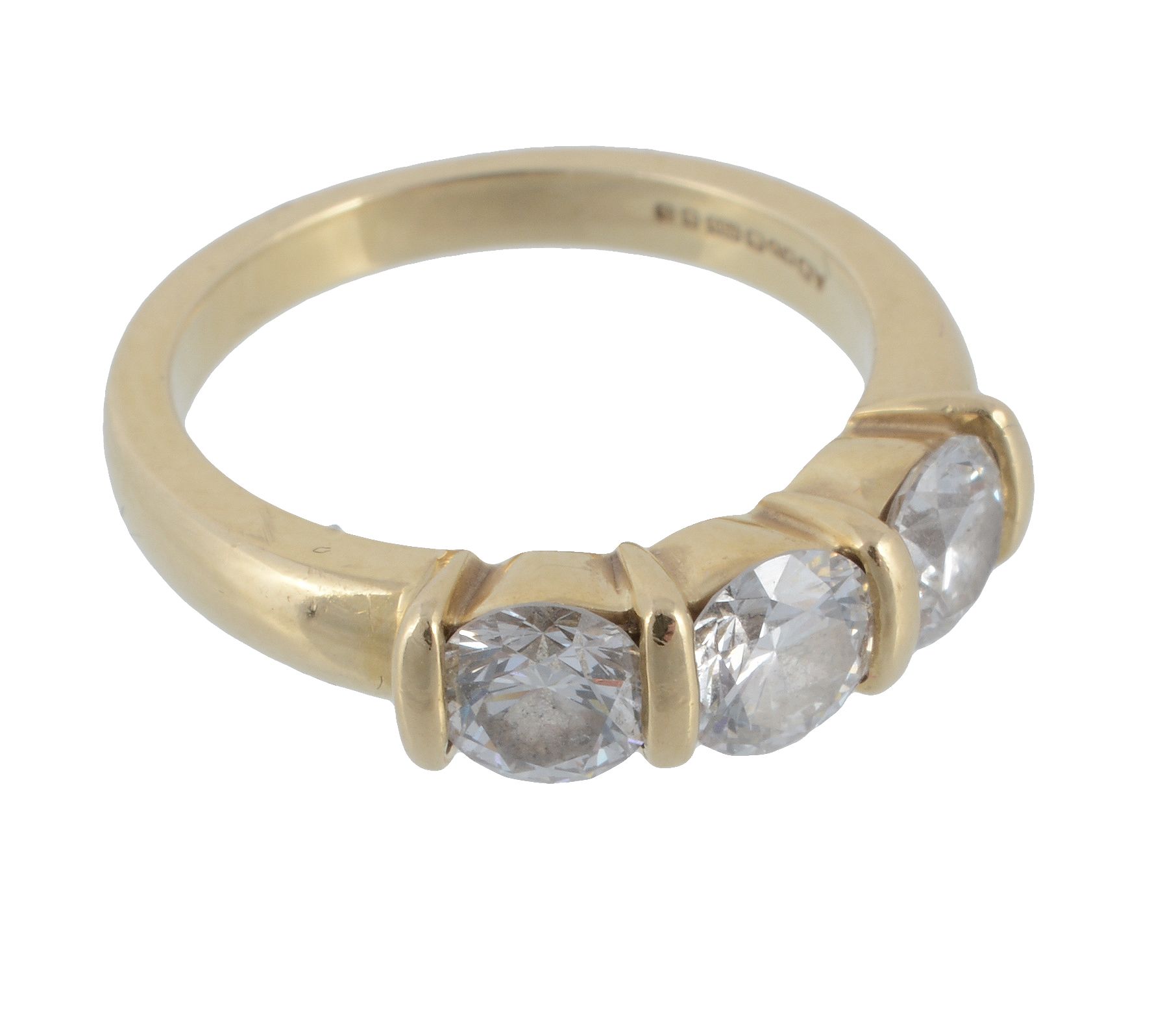 An 18 carat gold diamond three stone ring  An 18 carat gold diamond three stone ring,   set with